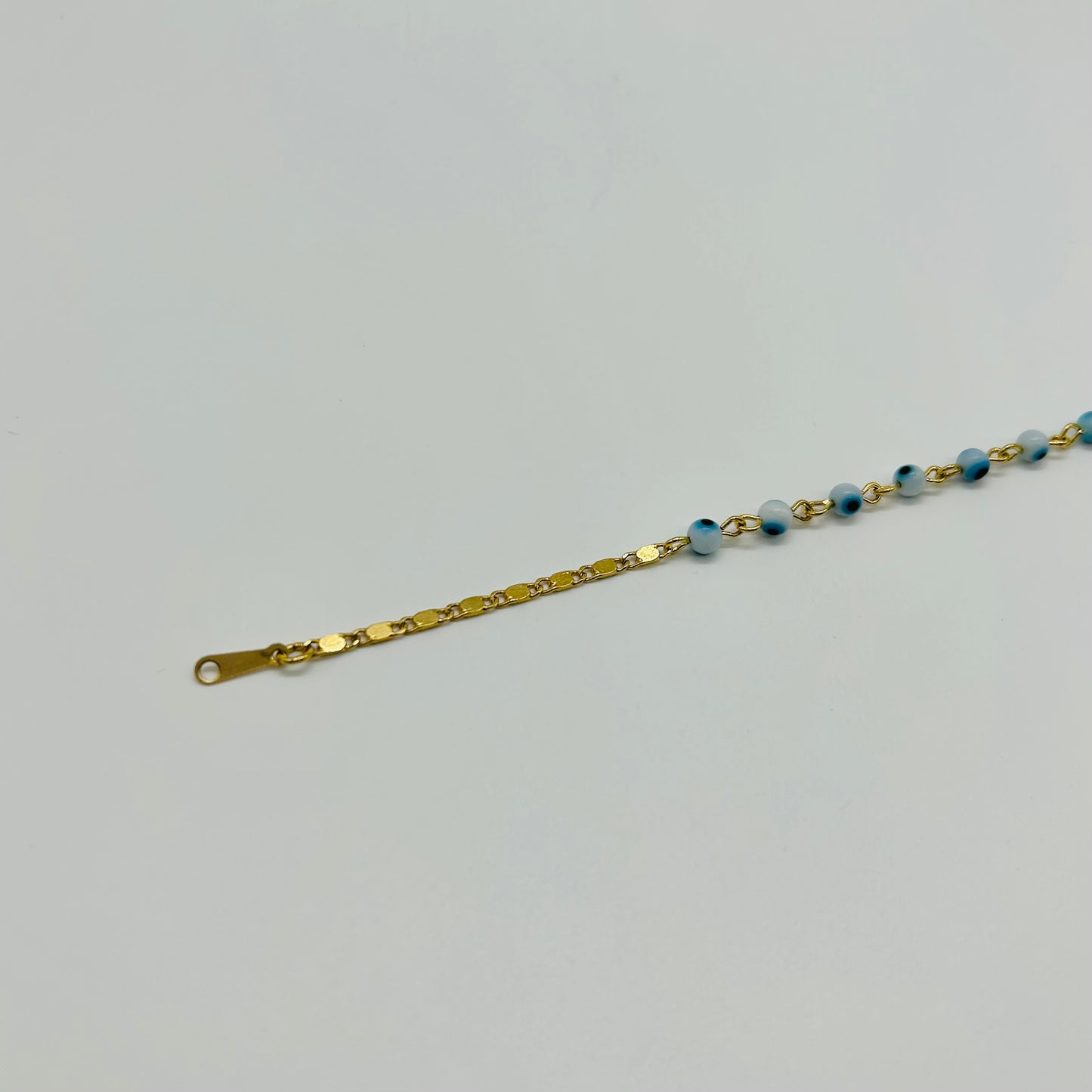 Pulsera de Ojitos Blanco con Azul de Oro Laminado