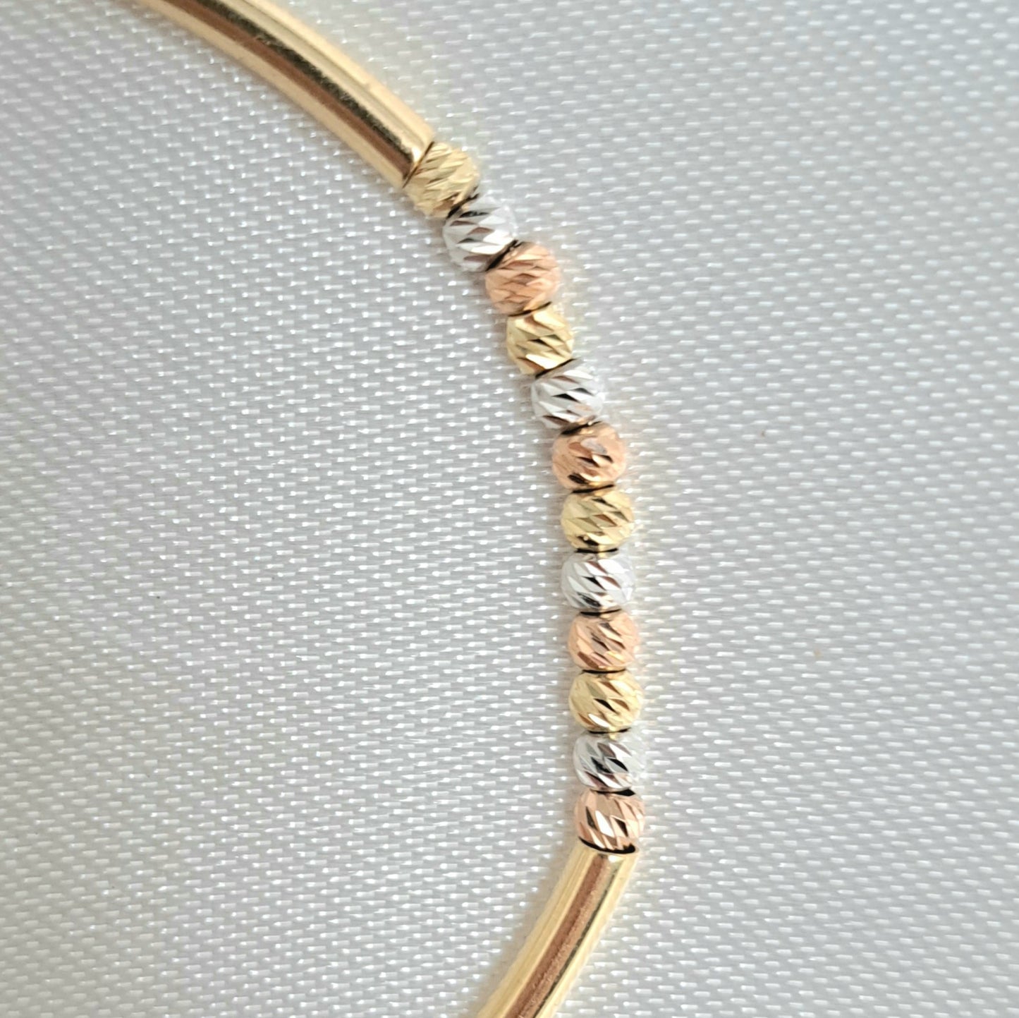 Pulsera con Tubitos y Bolitas en 3 Oros de 14K