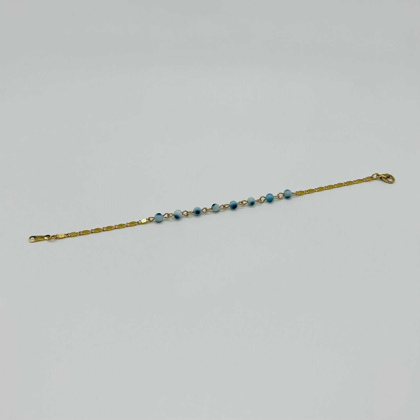 Pulsera de Ojitos Blanco con Azul de Oro Laminado