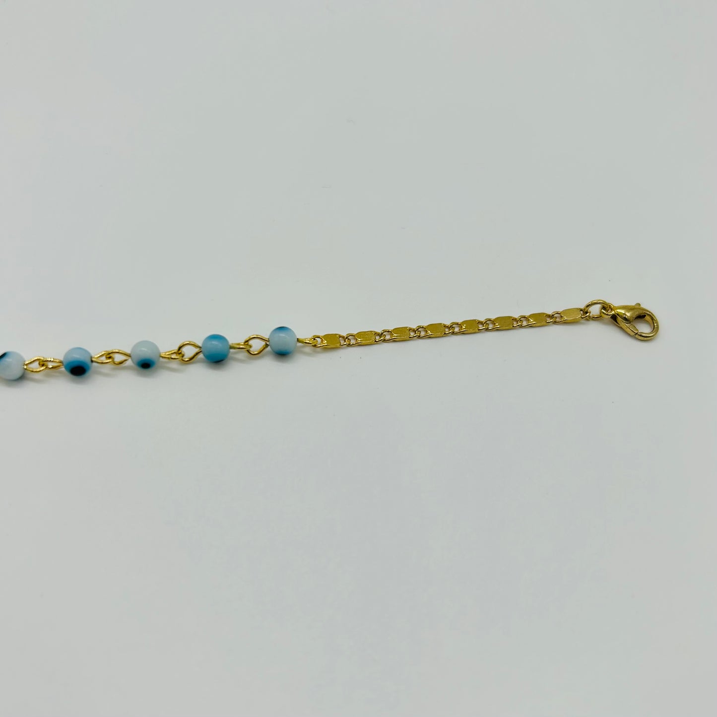 Pulsera de Ojitos Blanco con Azul de Oro Laminado
