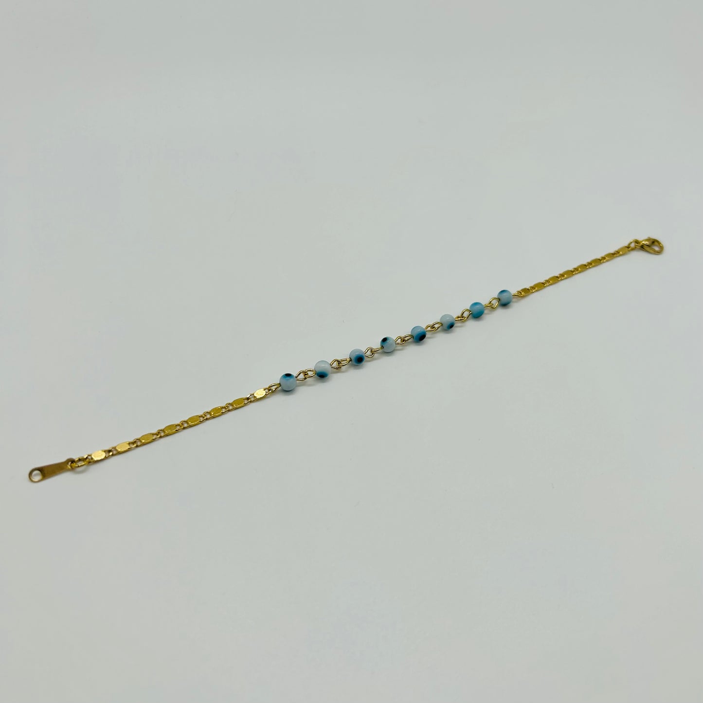 Pulsera de Ojitos Blanco con Azul de Oro Laminado